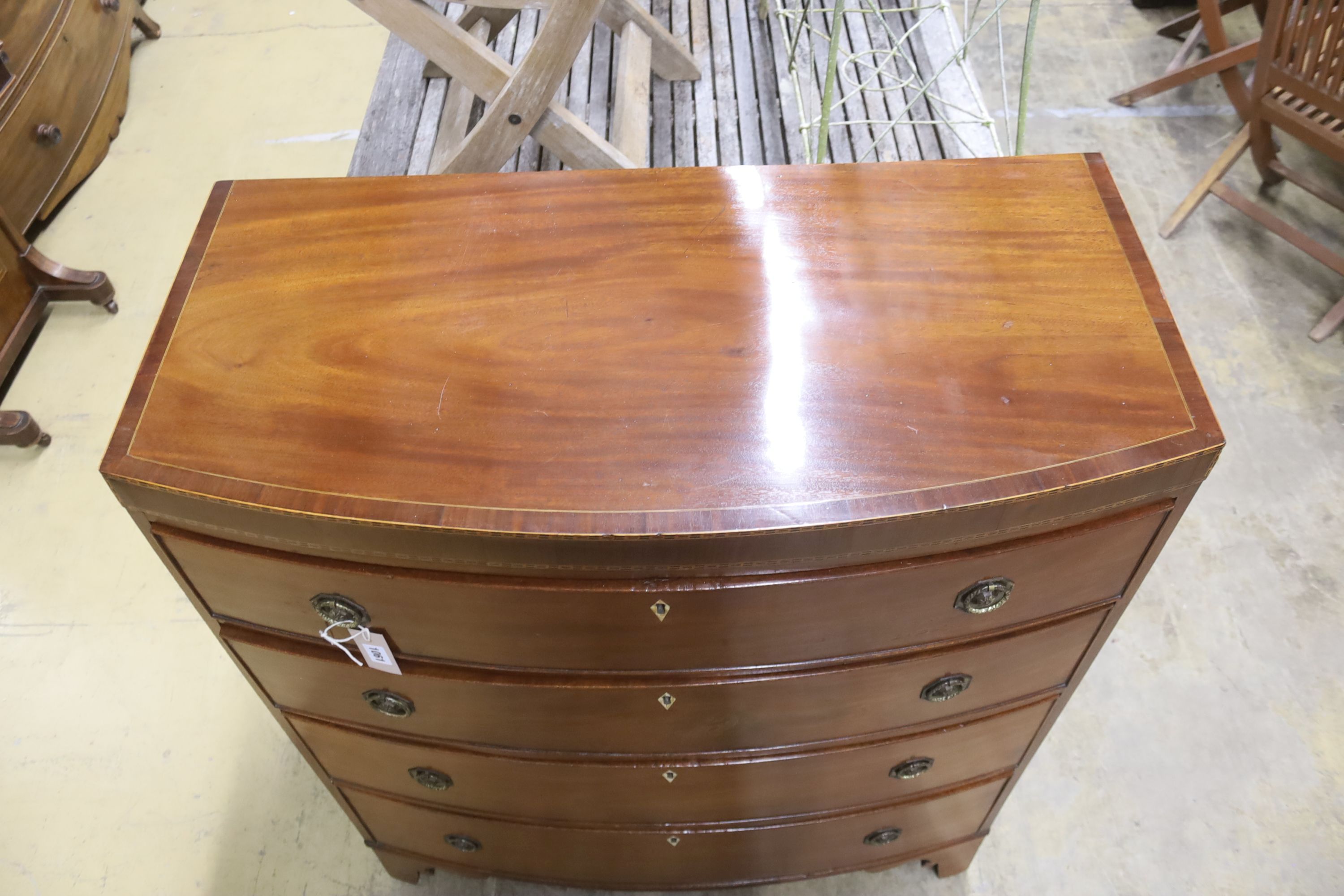 A Regency banded mahogany bowfront chest of drawers, width 92cm, depth 45cm, height 109cm